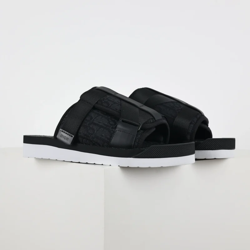 White and black closed-toe slippers