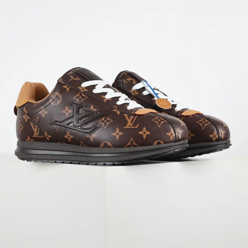 Buttersoft low-top sneakers in brown with monogram print