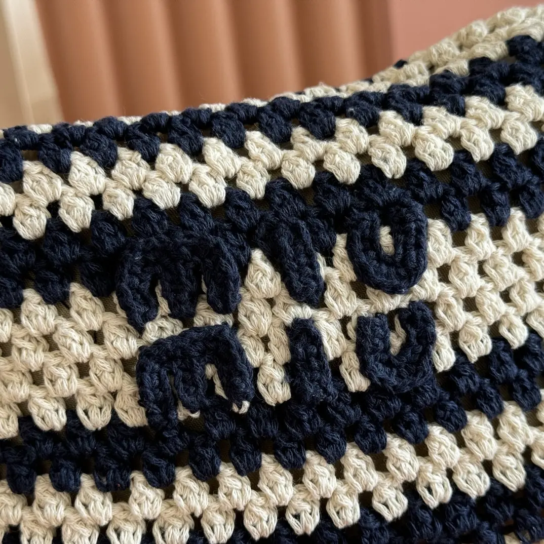 Black and white wool lunchbox bag. Dimensions: Base length 19cm, opening width 25.5cm, height 14cm, bottom width 10cm.4