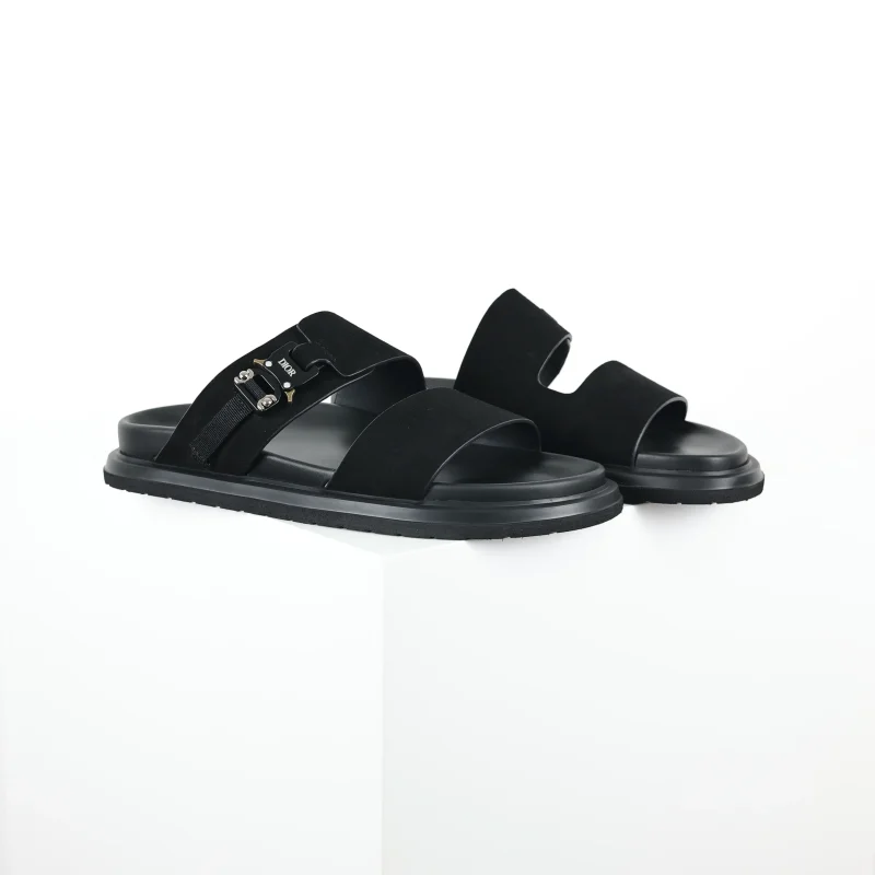 Aqua-colored, flat suede slippers with a round toe in black