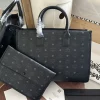 München black handbag dimensions: 14.5 x 37.5 x 27 cm2