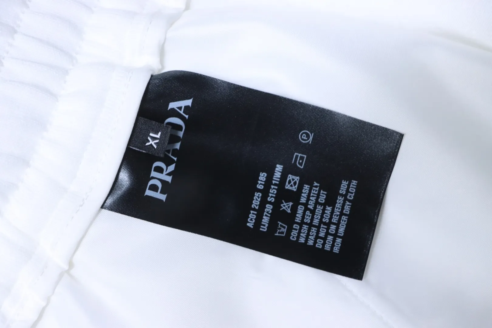 Badge and Letter Embroidered Knit Shorts - Care Label