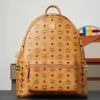 Brown medium-sized studded backpack. Dimensions: 41*15.5*33.5cm
