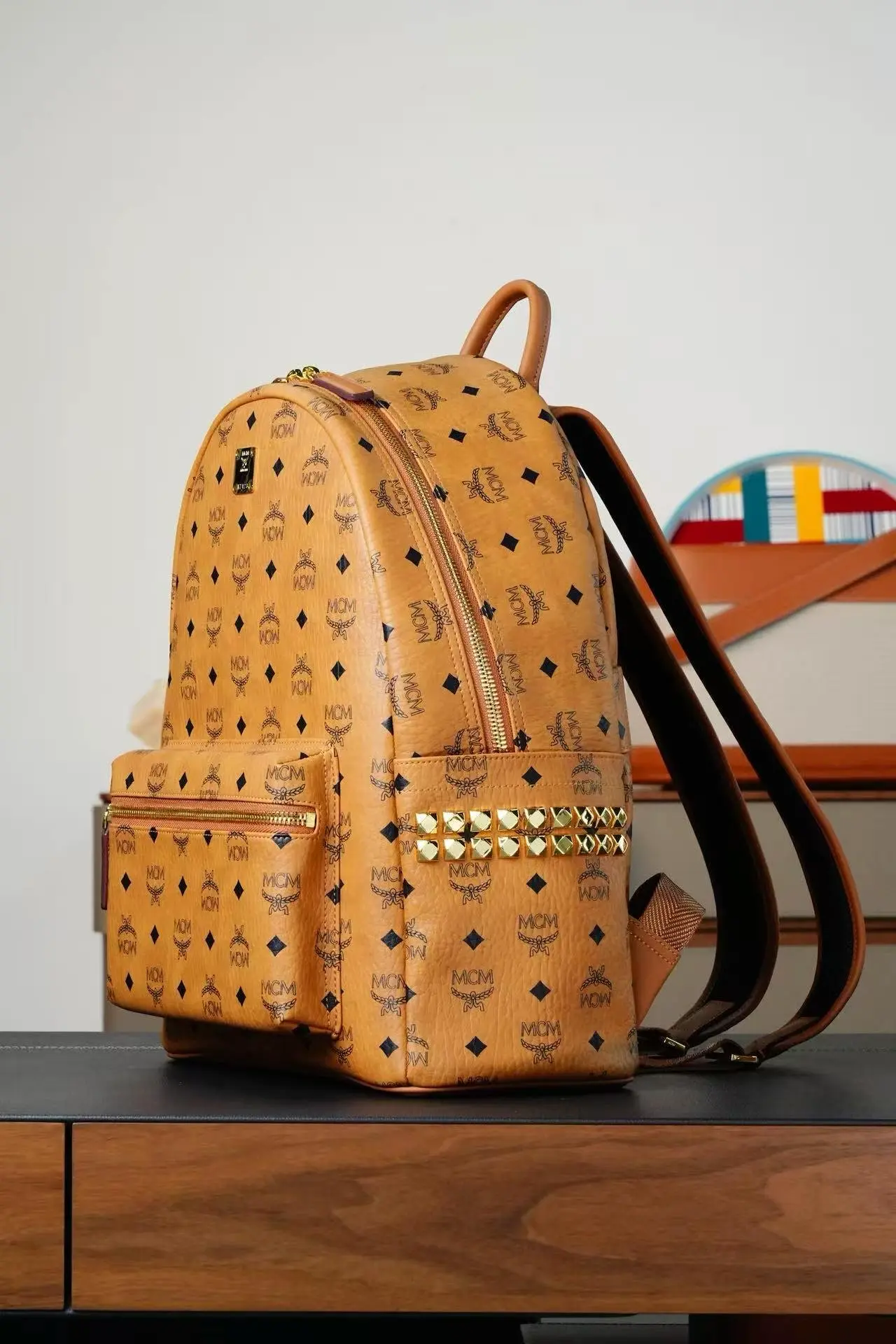 Brown medium-sized studded backpack. Dimensions: 41*15.5*33.5cm4