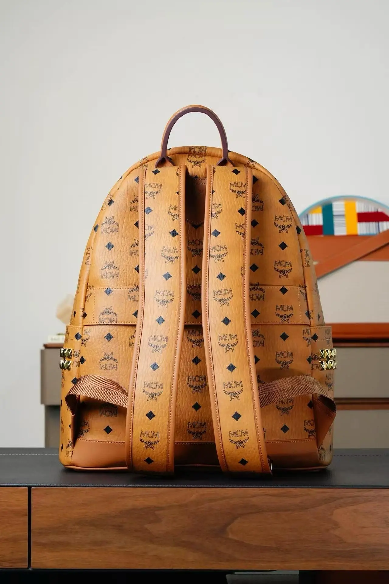 Brown medium-sized studded backpack. Dimensions: 41*15.5*33.5cm7