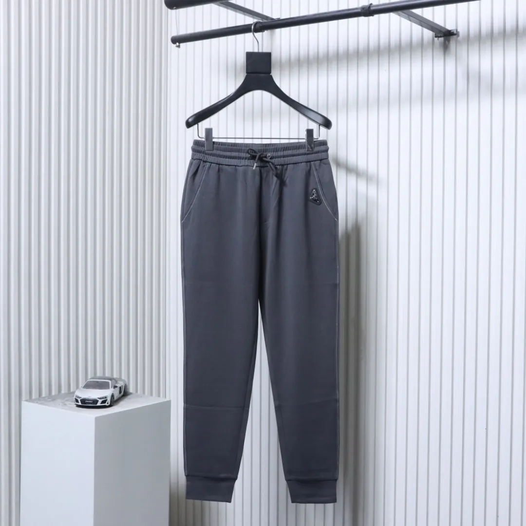 Casual Trousers with Triangle Logo Patch - Front View