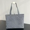Bottega Veneta's new suede woven tote bag. Dimensions: Height 31cm * Width 43cm * Depth 15.5cm