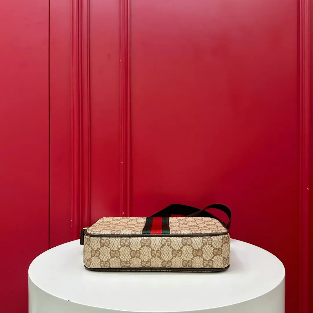 Kia mini handbag with woven ribbon, brown monogram. Dimensions: 21.5 x 14 x 5 cm3