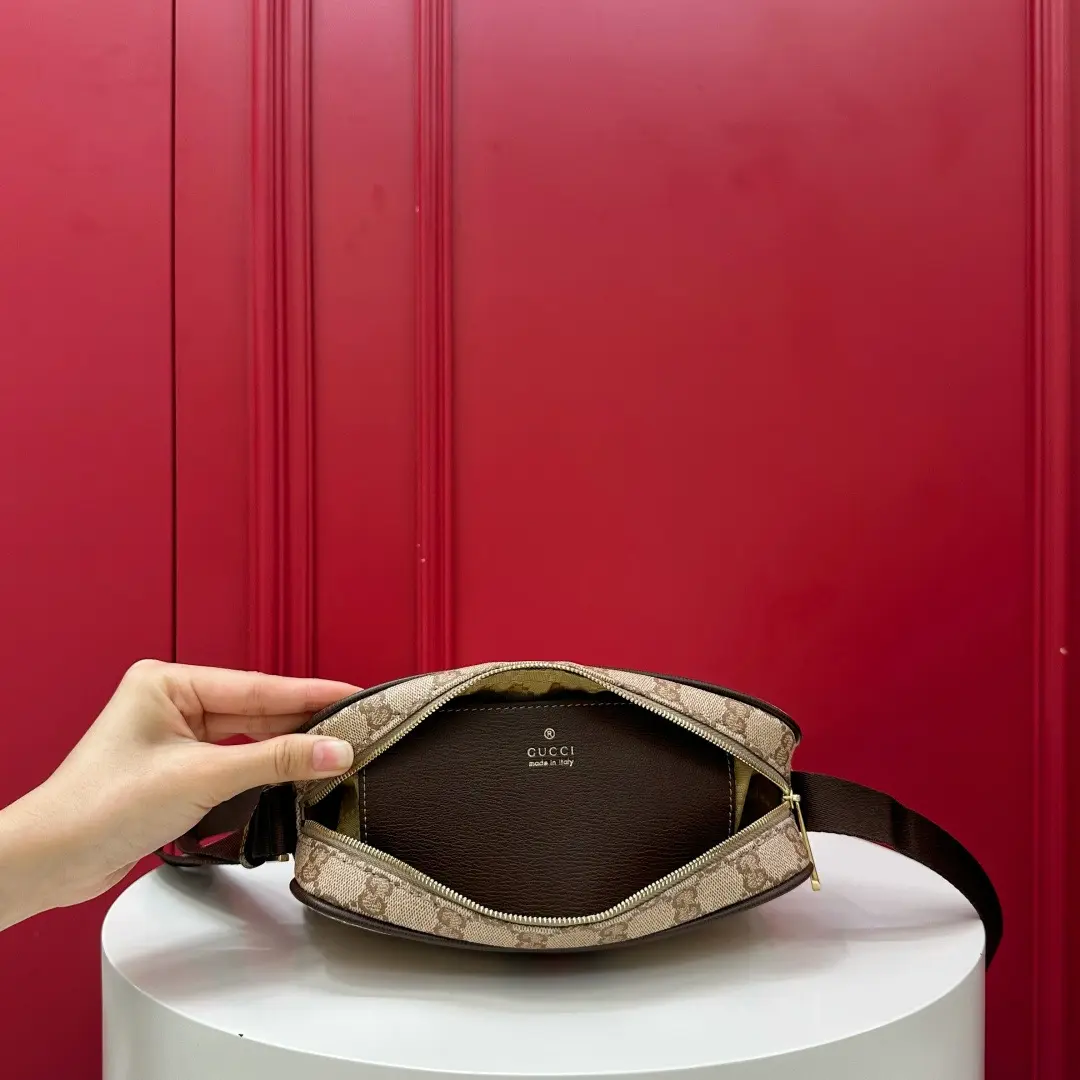 Kia mini handbag with woven ribbon, brown monogram. Dimensions: 21.5 x 14 x 5 cm5