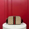 Kia mini handbag with woven ribbon, brown monogram. Dimensions: 21.5 x 14 x 5 cm