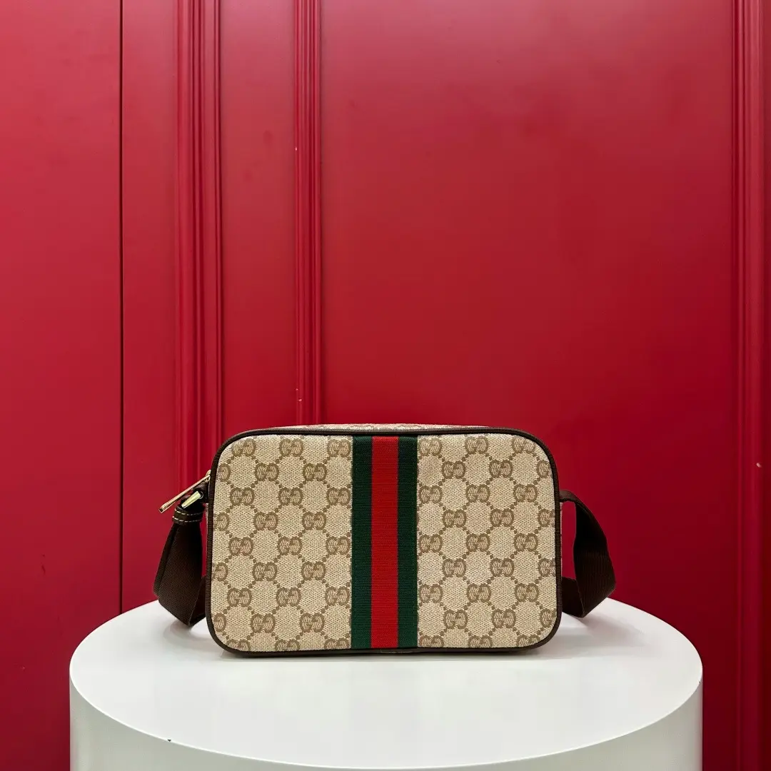 Kia mini handbag with woven ribbon, brown monogram. Dimensions: 21.5 x 14 x 5 cm Kia mini handbag with woven ribbon, brown monogram. Dimensions: 21.5 x 14 x 5 cm