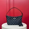 Small shoulder bag, monogrammed, dark blue. Dimensions: 22-14-5.5cm