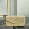 This brown embroidered Félicie chette measures 21 x 12 x 3 cm (length x height x width)